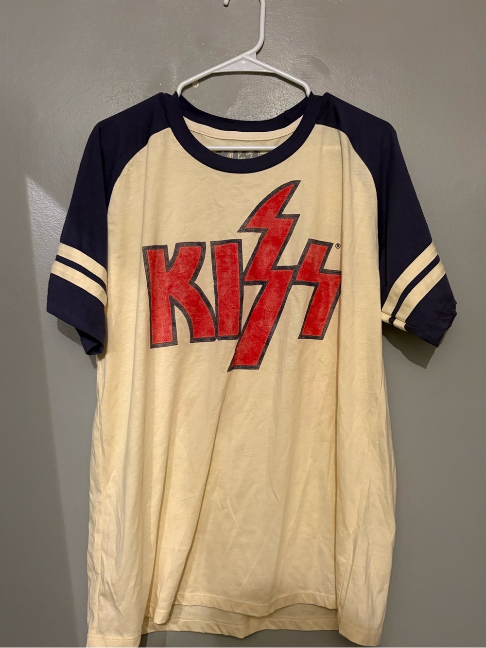 Kiss Cream Tee with Navy Raglan Sleeves and Red Logo